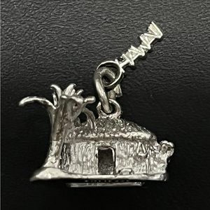 Hawaii Charm or Pendant Sterling Silver.

Palm Tree, Grass Hut and Hawaii tag.